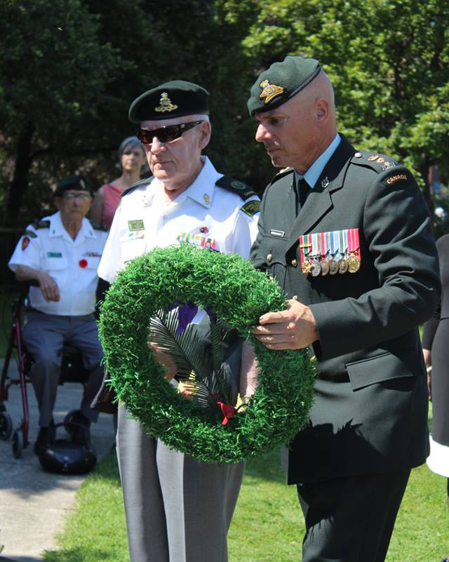 Photo of soldiers laying a wreath