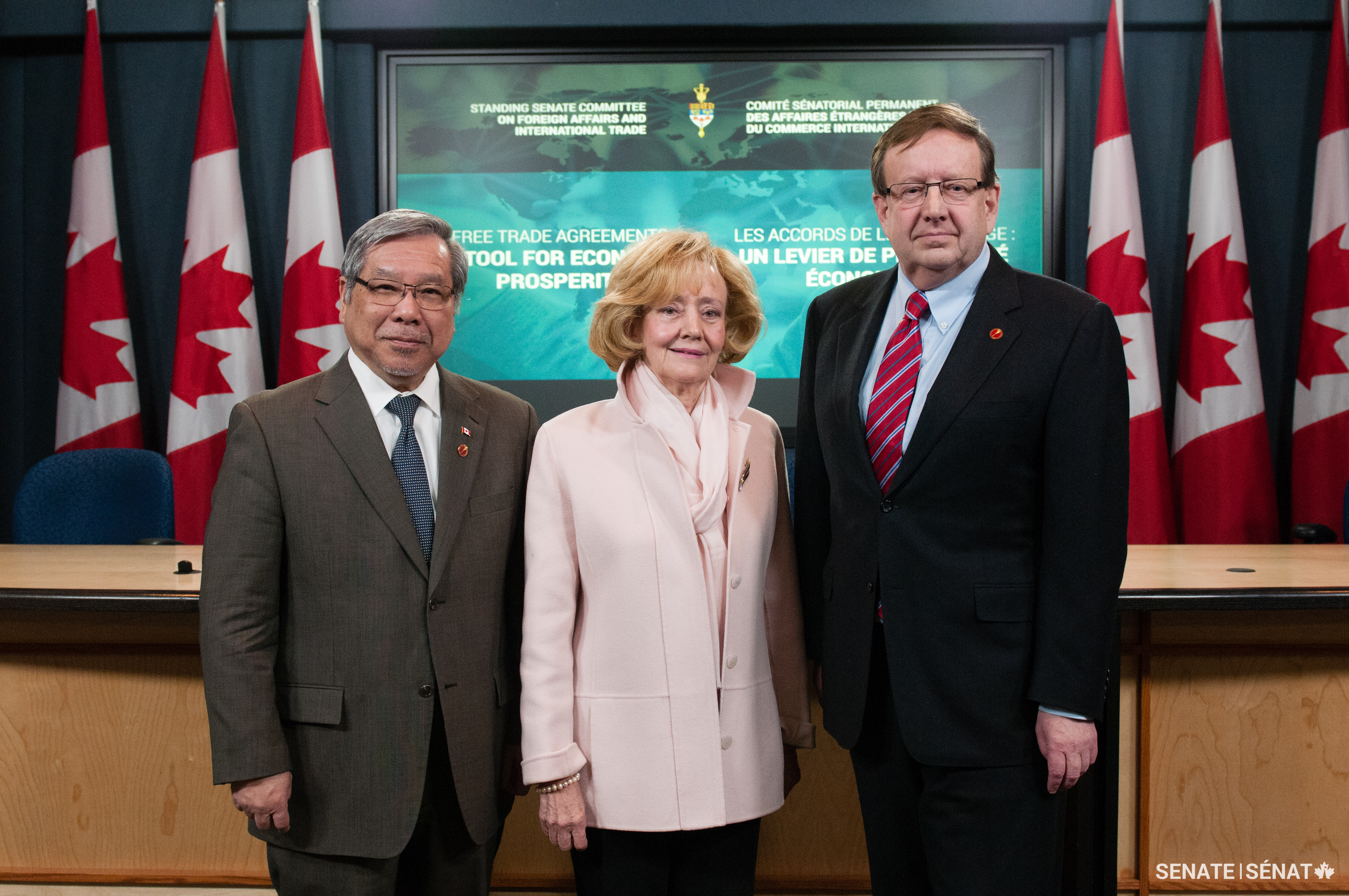 Senators Thanh Hai Ngo, Raynell Andreychuk and Percy Downe present a report calling on the government to increase public awareness and parliamentary oversight of international free trade agreements.