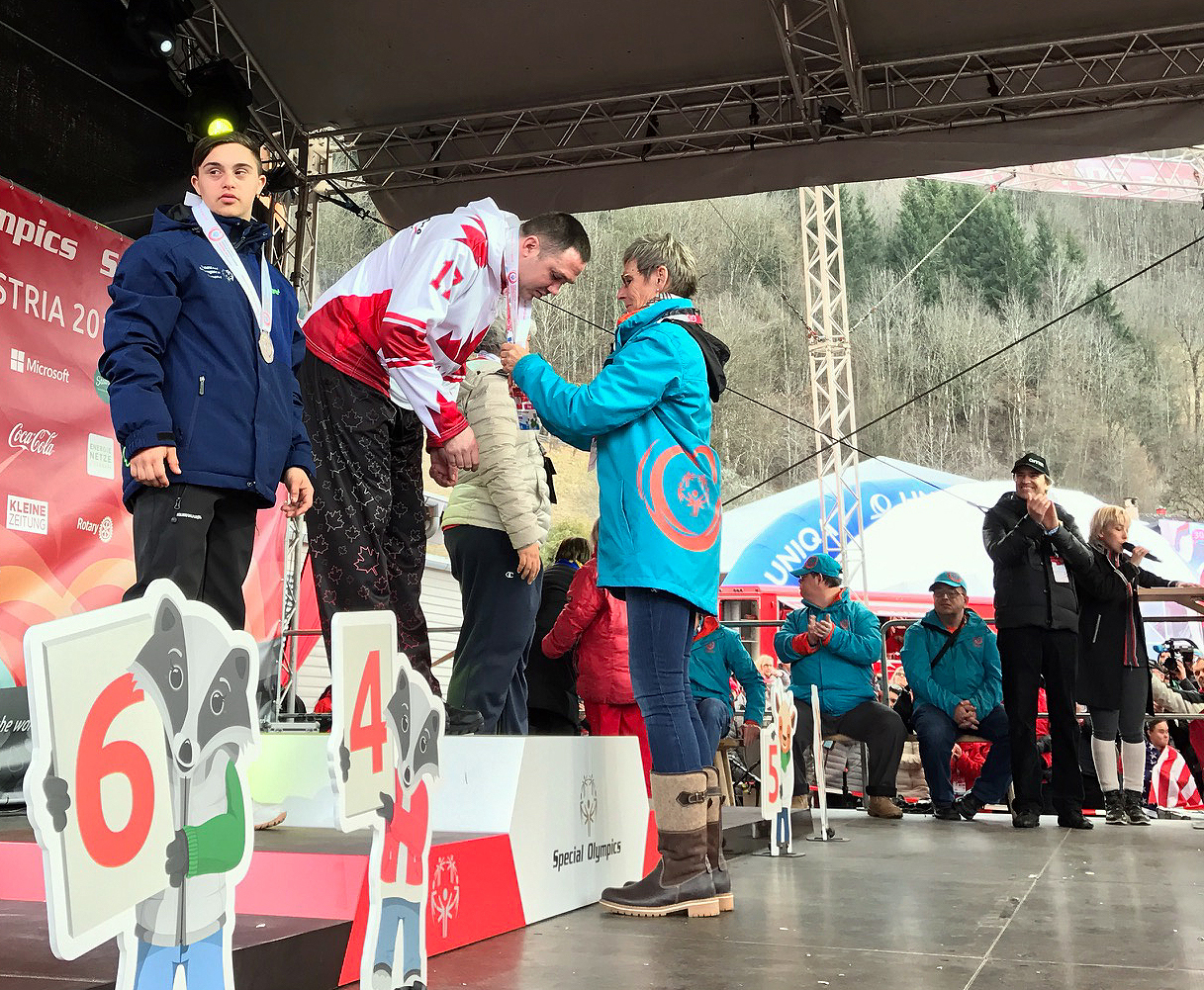 Mike Langridge of Vernon, B.C., receives his gold medal in the alpine novice super-G event. He also picked up gold in the giant slalom.