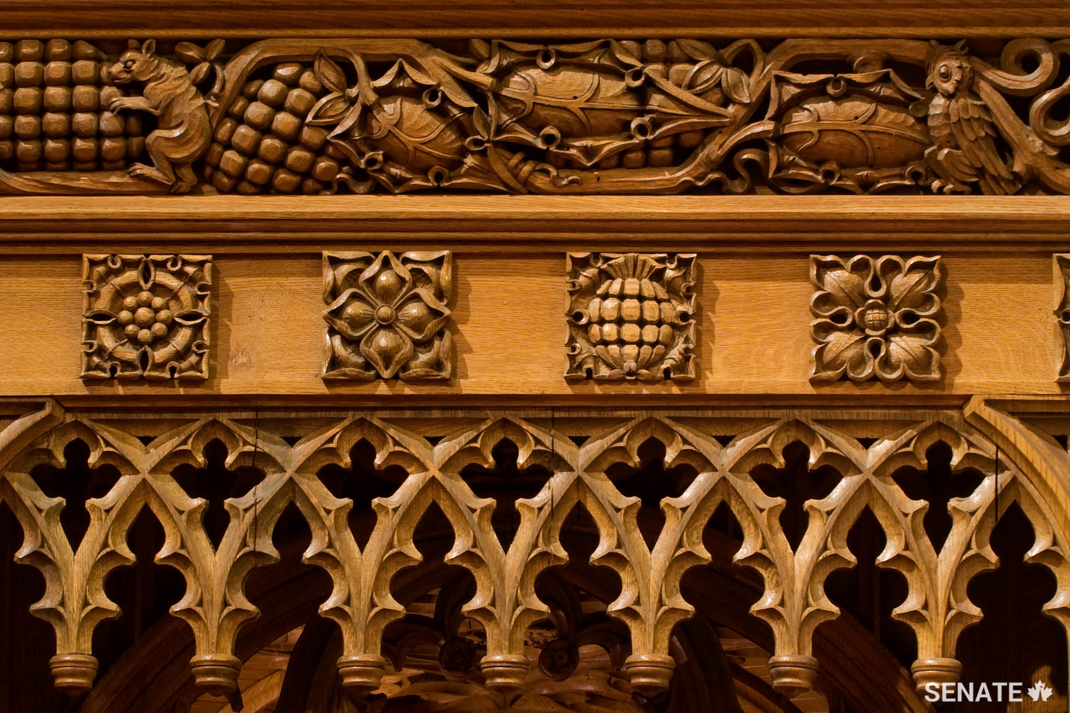 Squirrels, rabbits and jays, representing industry and incessant energy, cavort in the chamber’s intricate oak wainscoting, carved in the 1920s.