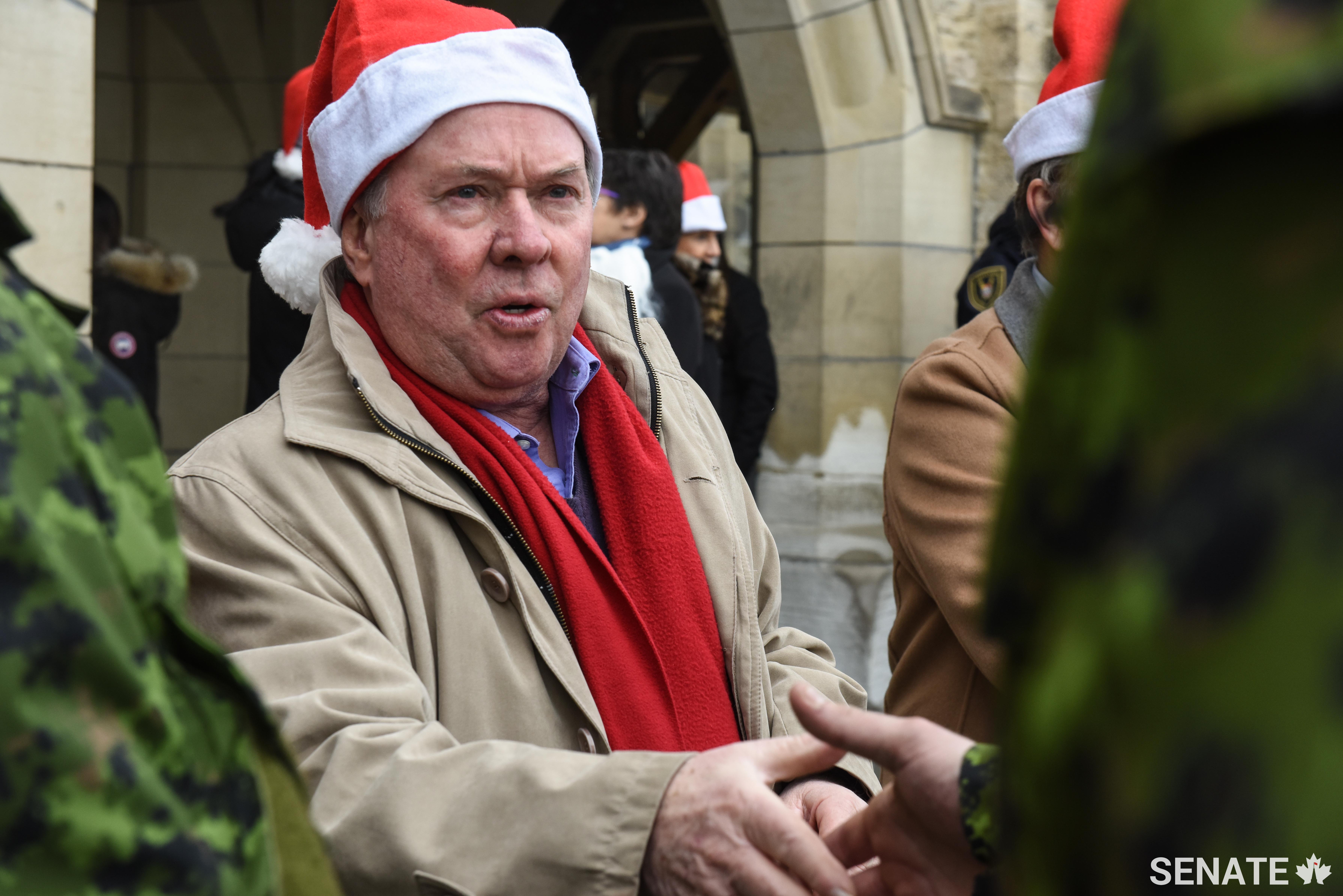 Senator Jim Munson thanks members of the Canadian Armed Forces who picked up the Senate’s contribution to this year’s Toys for Tots campaign on Friday, December 15.