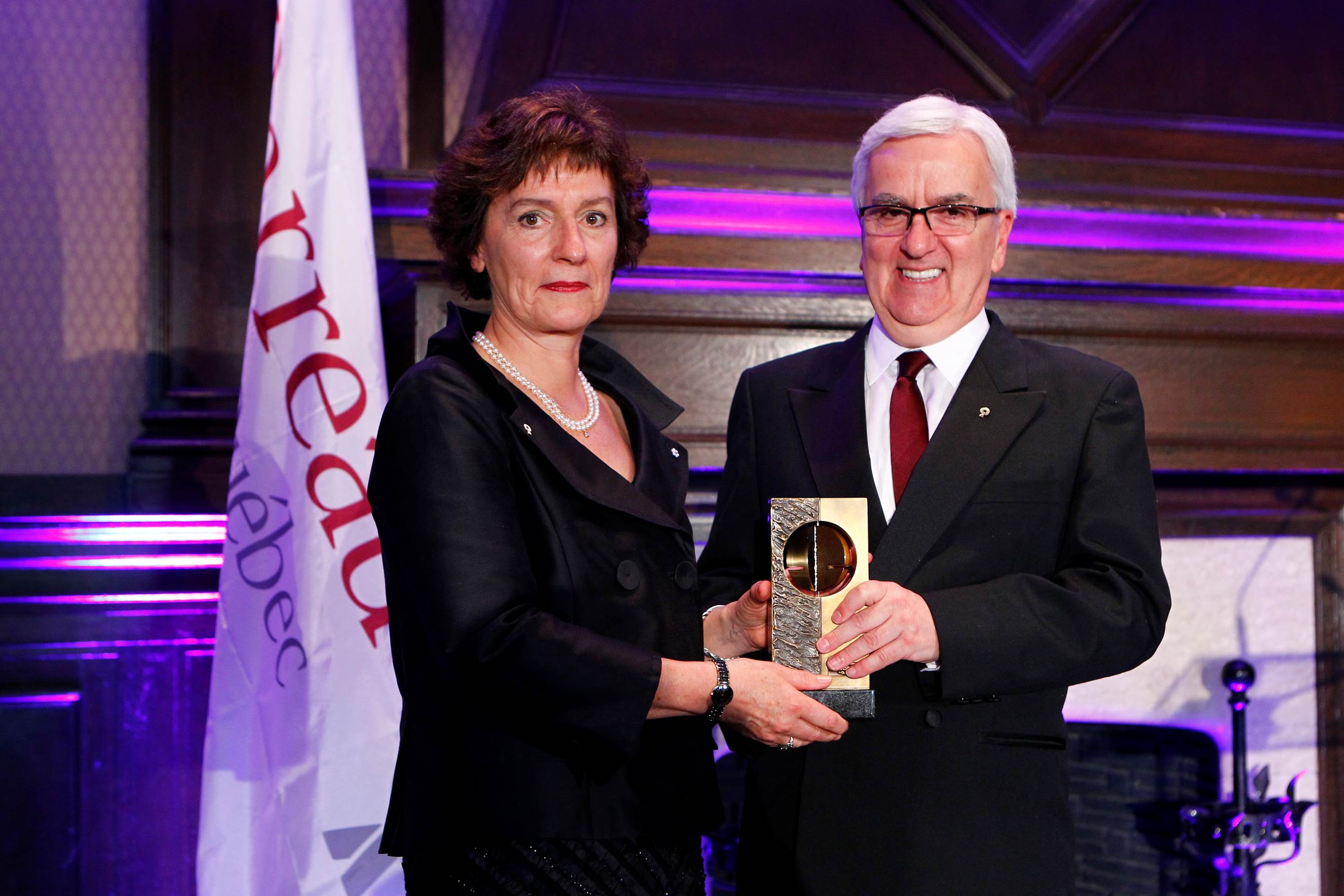 The President of the Barreau du Québec, Louis Masson, presents Senator Renée Dupuis with the Médaille du Barreau in June 2012. As the most prestigious distinction of the Barreau du Québec, it highlights remarkable contributions made by Quebec lawyers in advancing the practice of the law. The award was presented to the senator for her contributions to human rights law, Indigenous rights law and administrative law.