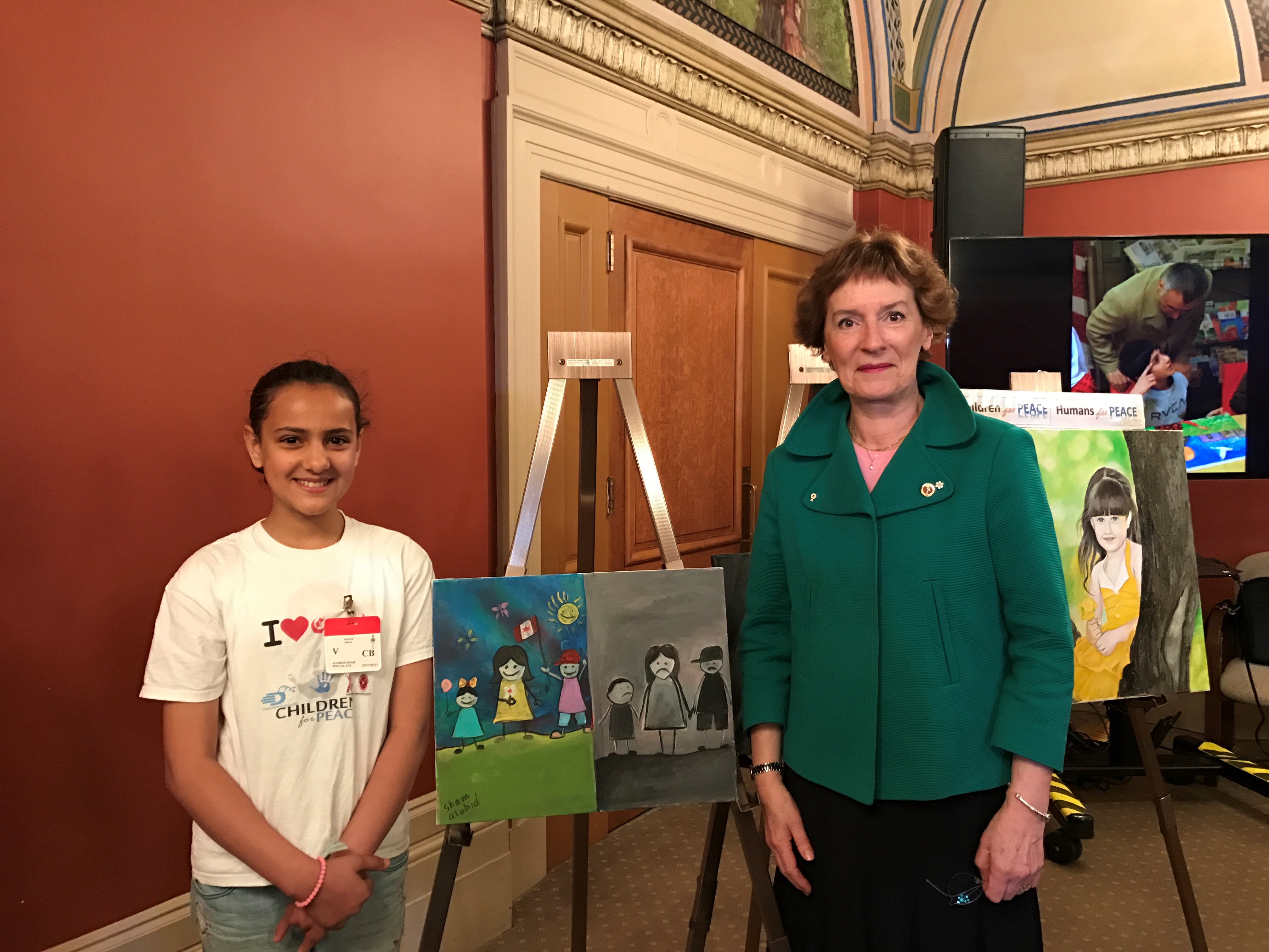 Senator Dupuis takes part in Children For Peace, a program that brought more than a dozen Syrian refugee children to Parliament Hill to display paintings inspired by their experiences in May 2017.