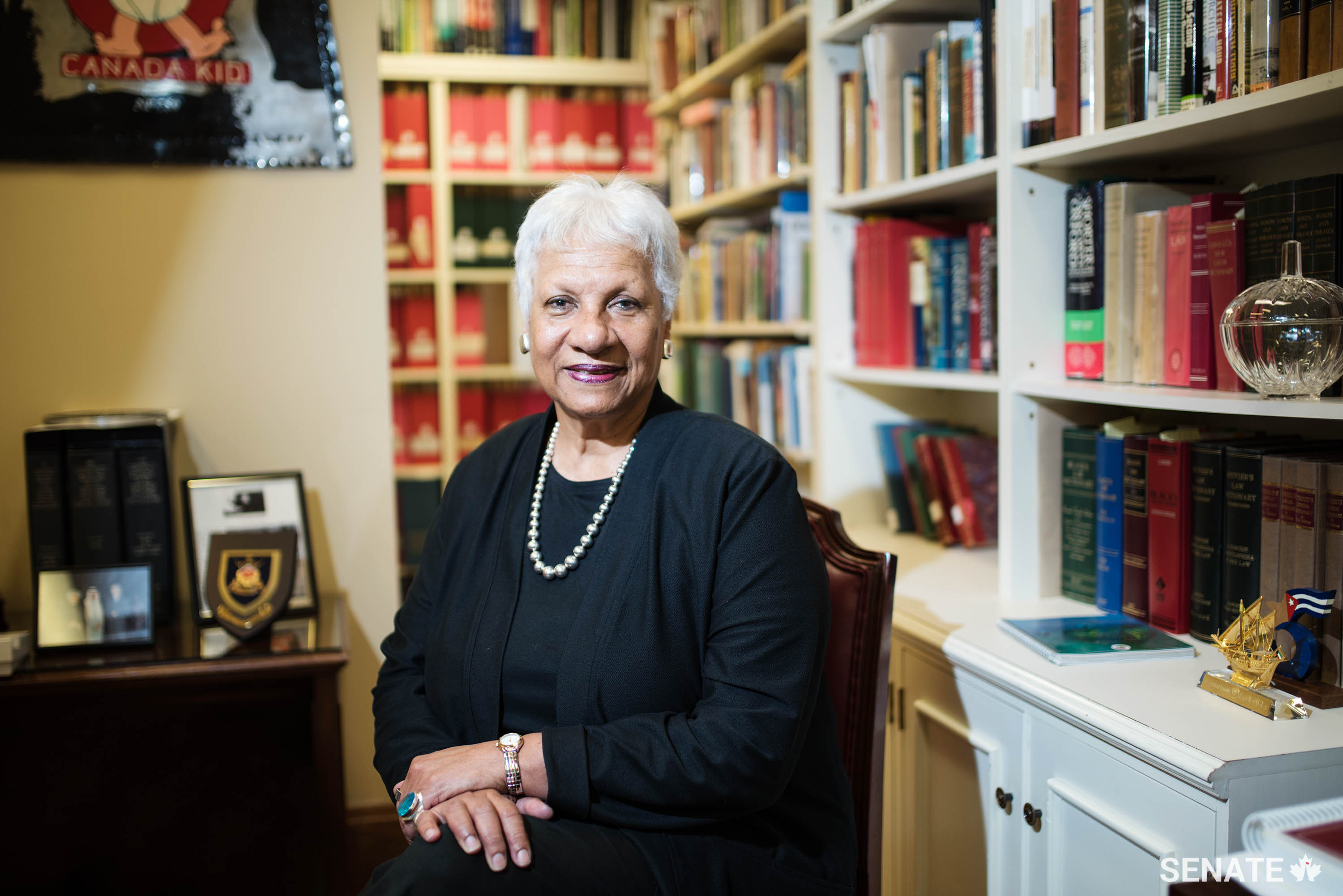 Senator Anne Cools sits in her Senate office. Senator Cools earned a reputation as a procedural master and for her thoroughly researched speeches. She attributes her ability to communicate ideas respecting Parliament, society and the law to her vast reading and comprehension of Canadian constitutional history.