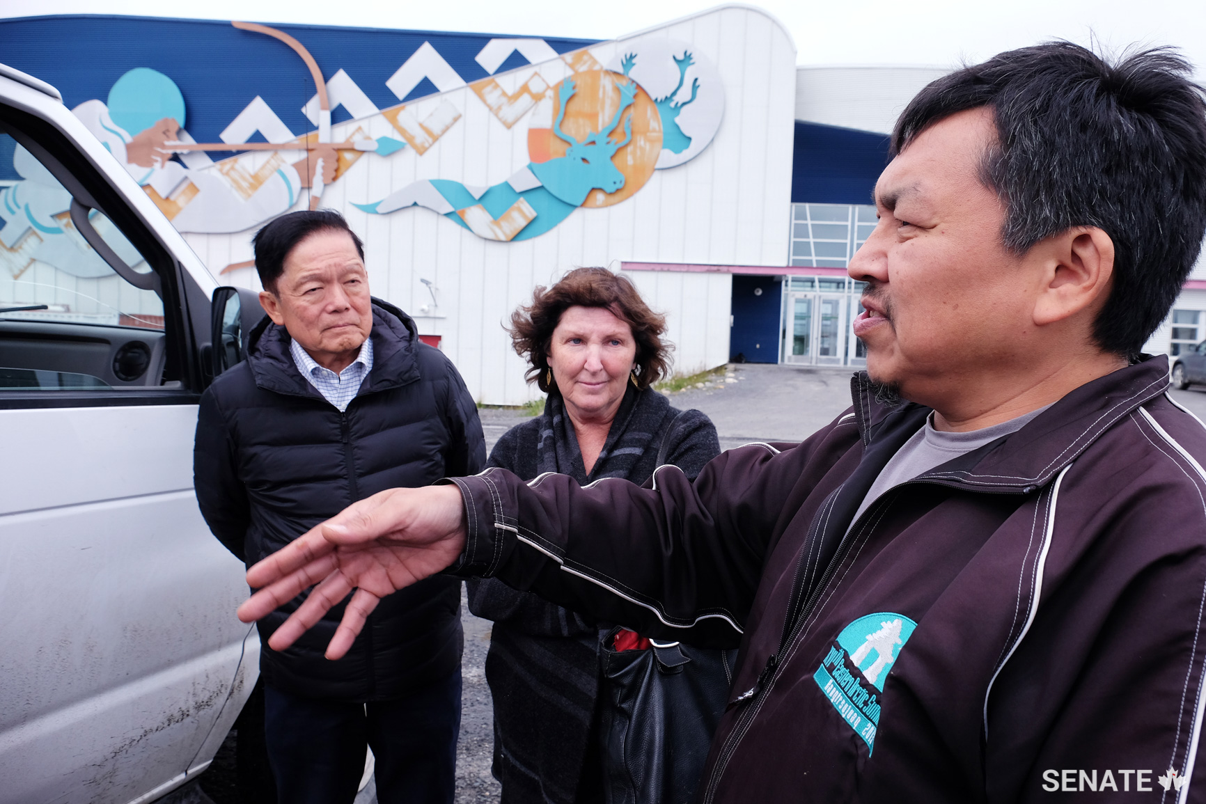 Kuujjuaq Mayor Tunu Napartuk, right, tells senators Victor Oh and Mary Coyle about inadequate housing in his hamlet. Homes are often overcrowded with multiple generations of family members living in the same dwelling. The lack of adequate housing was a recurring theme raised by northerners throughout their meetings with the committee.