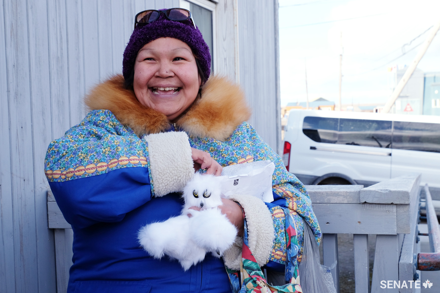 An Inuk artist sells owl magnets outside the Arctic College in Cambridge Bay, Nunavut.
