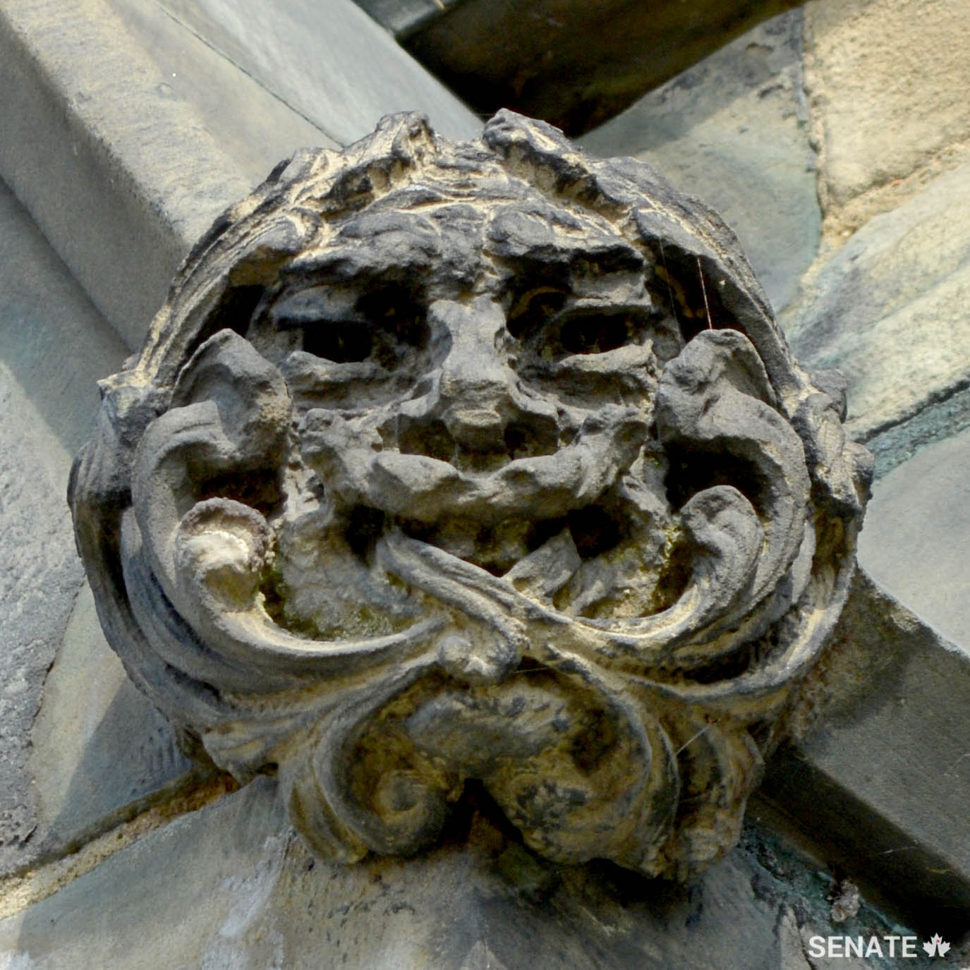 A Green Man appears on a window dormer on the exterior of Centre Block.