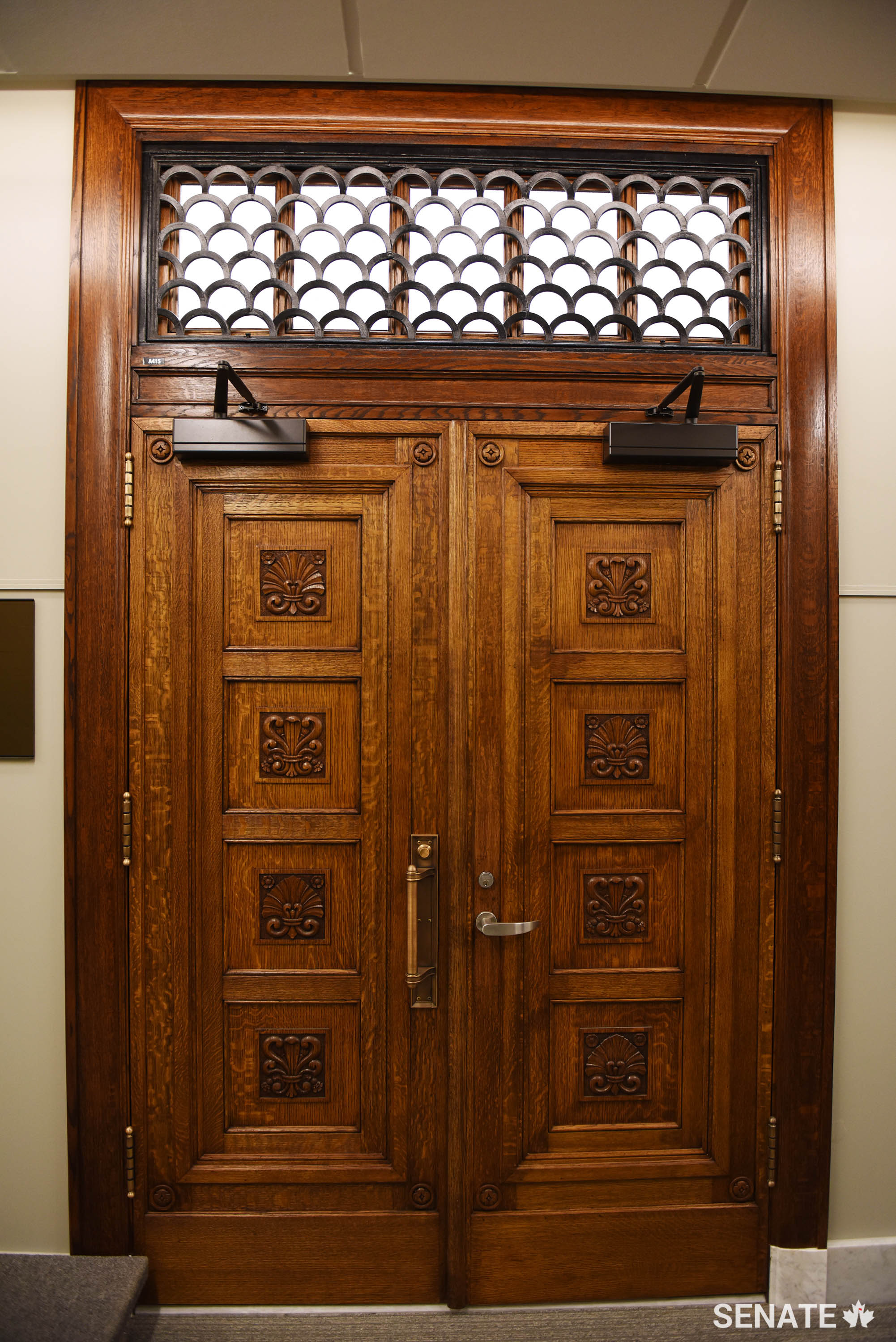 Salvaging original materials — like those found in this doorway and in the marble baseboards lining the hallways of the Senate of Canada Building — preserves the cultural heritage of the building.