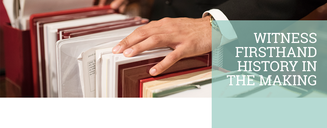 Image of hand on books and quote "Witness firsthand history in the making"