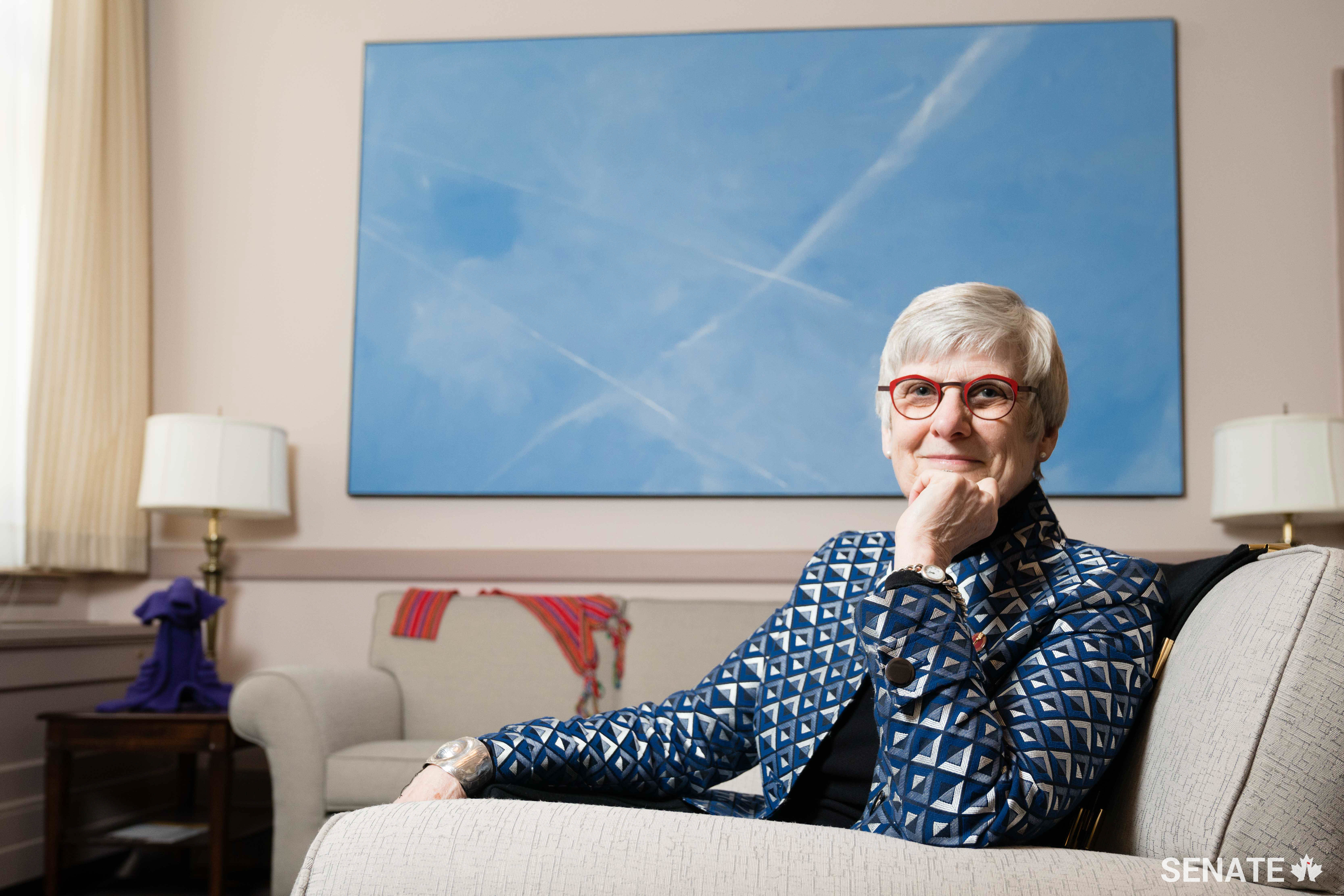 Senator Patricia Bovey’s East Block office features a work by Manitoba painter Roger Lafrenière, "The Zone," a 1.5 x 3-metre canvas depicting a vast contrail-streaked Prairie sky.