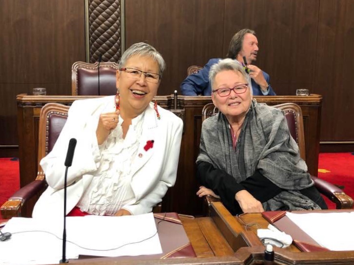 Senator Dyck smiles with longtime seat mate and friend Senator Sandra Lovelace Nicholas in February 2020.