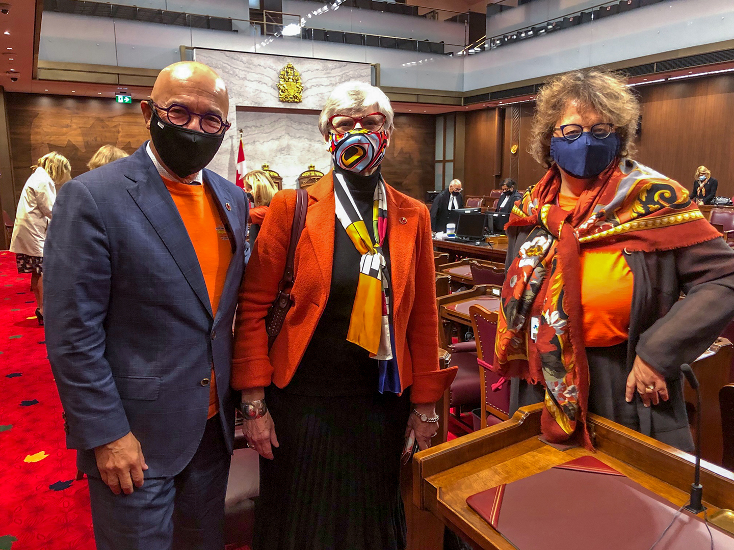 Wednesday, September 30, 2020 — Senators René Cormier, Patricia Bovey and Paula Simons wear orange to mark Orange Shirt Day, which honours the victims and survivors of residential schools.