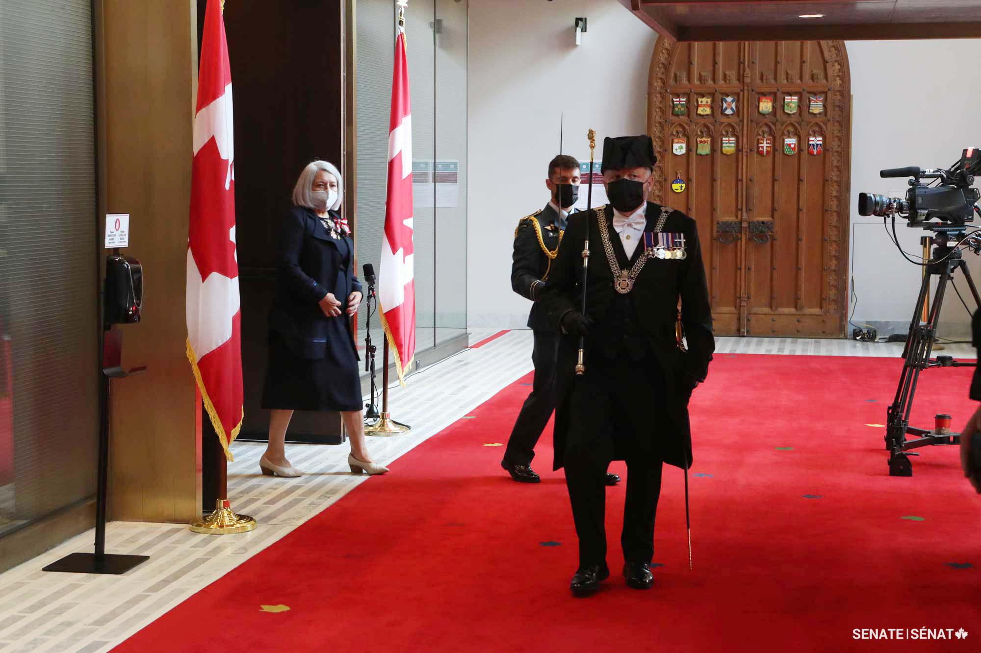 Governor General Mary Simon leaves the Senate led by the Usher of the Black Rod J. Greg Peters.