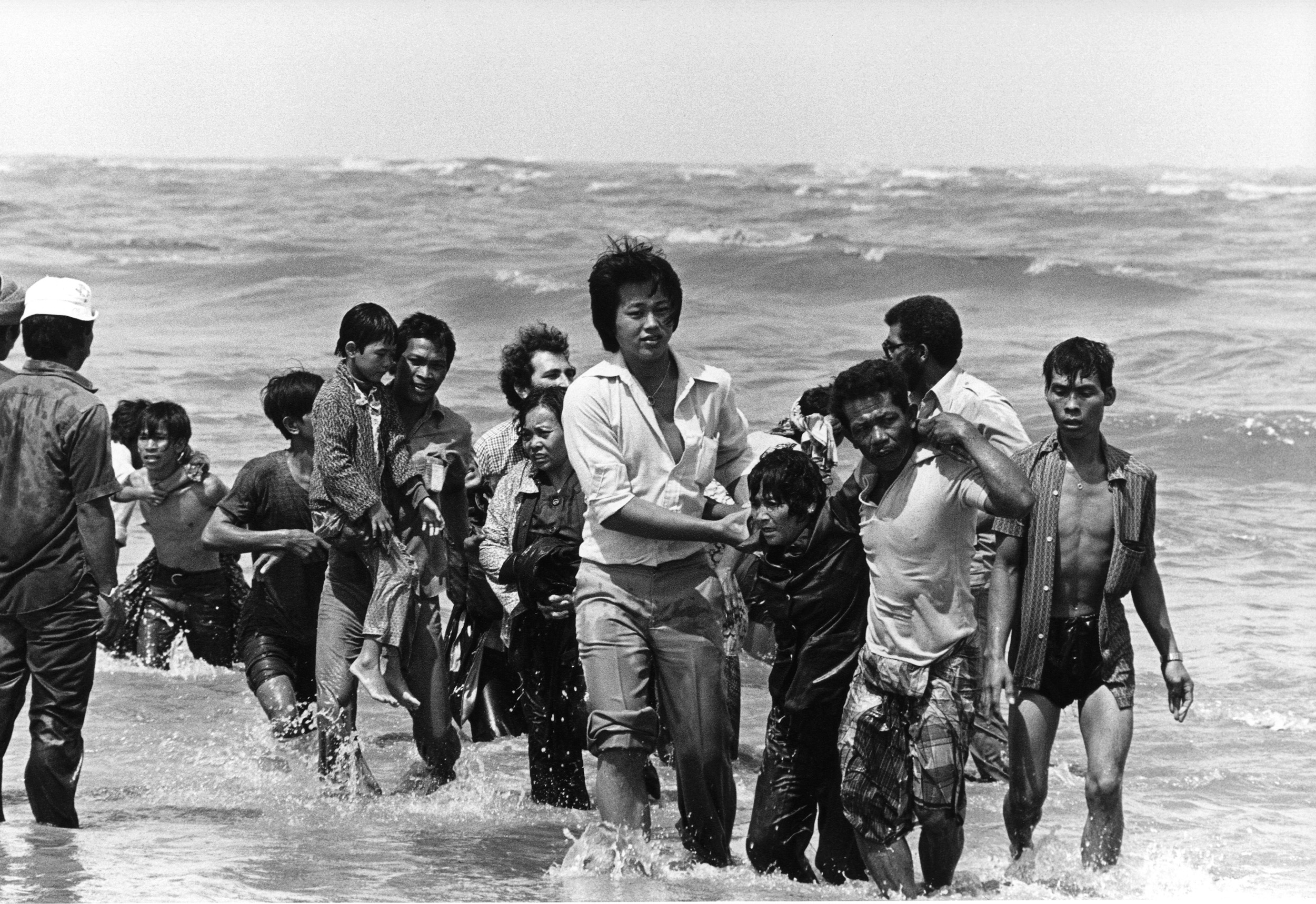 Photo of Vietnamese refugees walking out of the water.