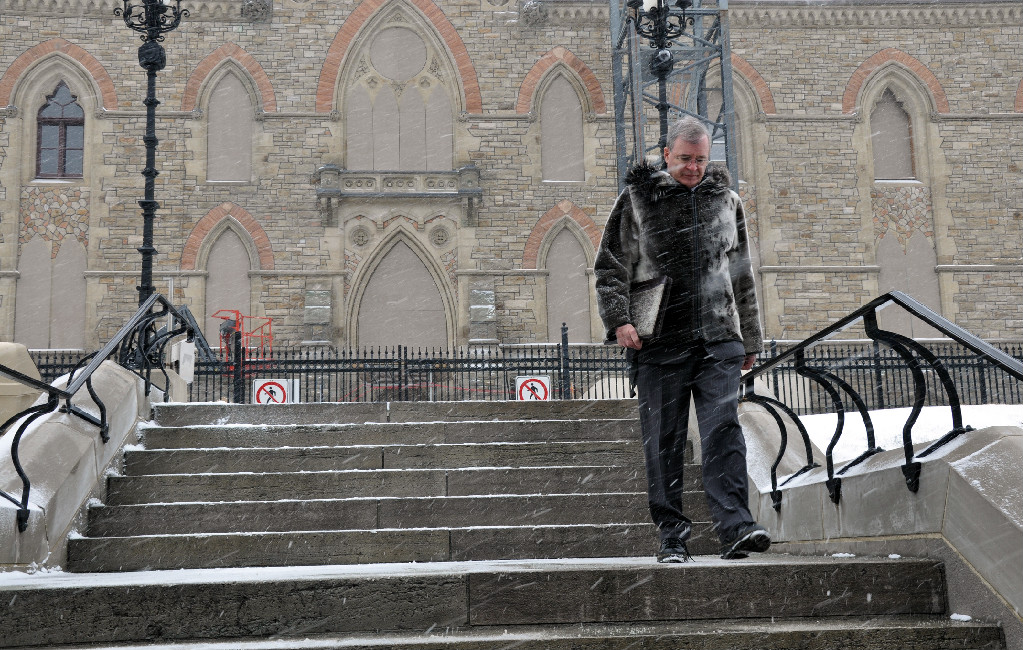 Senator Patterson walks on snowy Parliament Hill.