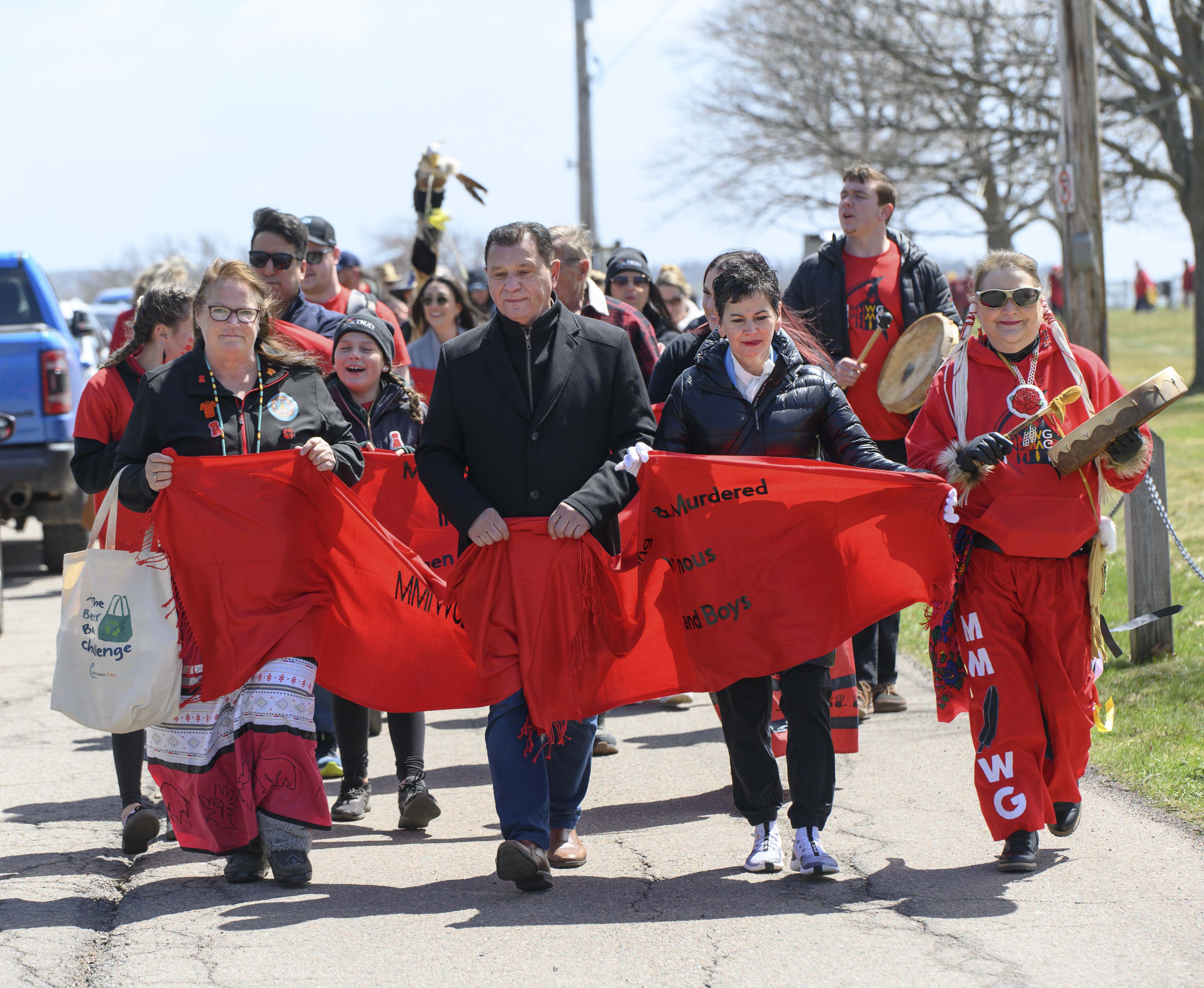 Friday, May 5, 2023 – Senator Brian Francis, centre, gathers with community members at Victoria Park in Charlottetown, Prince Edward Island, to mark the National Day of Awareness for Missing and Murdered Indigenous Women, Girls and Two-Spirit People, also known as Red Dress Day. (Photo credit: Patricia Bourque.)