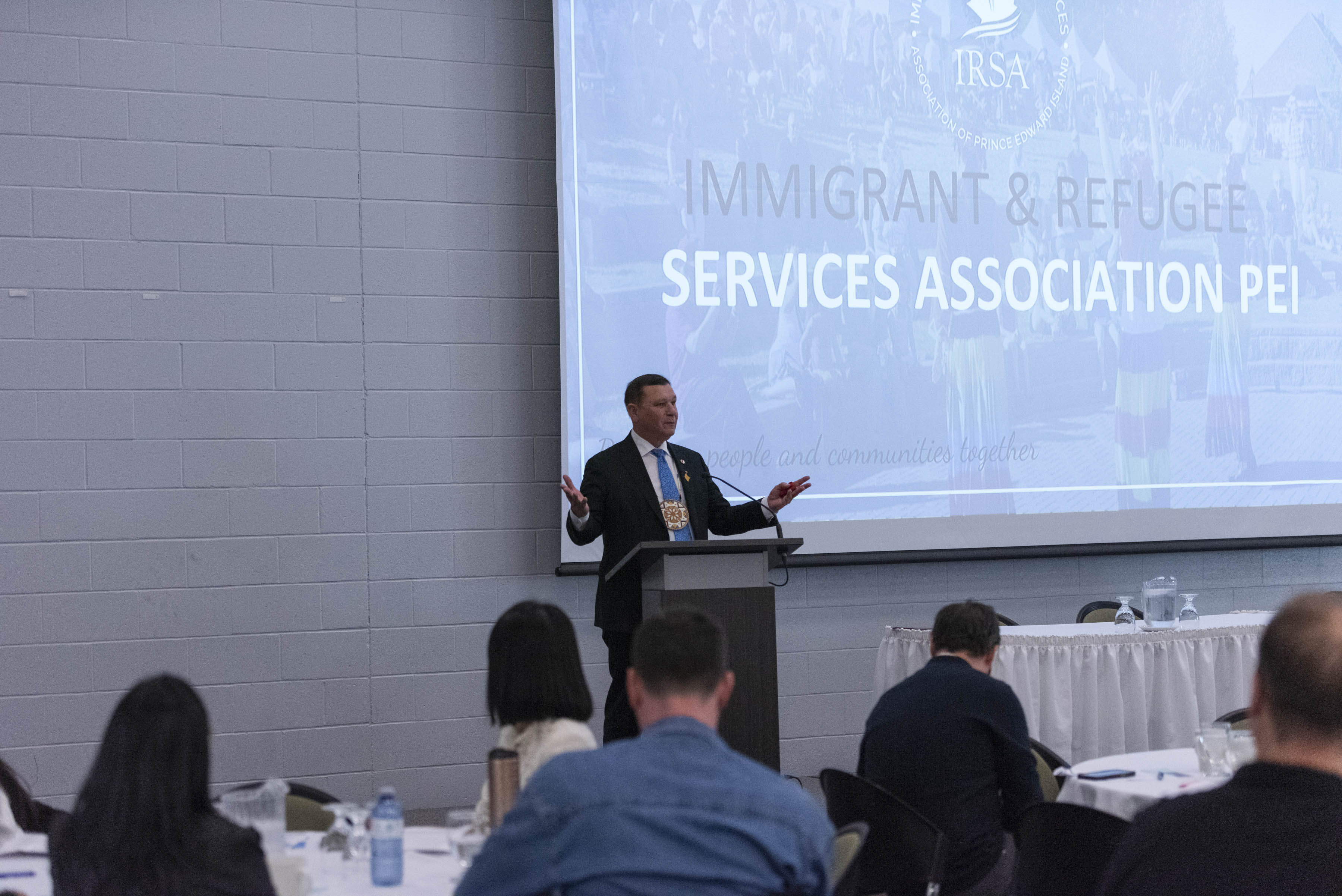 Friday, May 12, 2023 – Senator Brian Francis delivers a keynote speech on the topic of reconciliation during a celebration to mark the opening of a new office in Summerside, Prince Edward Island, by the Immigrant and Refugee Services Association PEI.